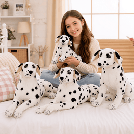 Woman sitting on a bed with large Dalmatian plush toys