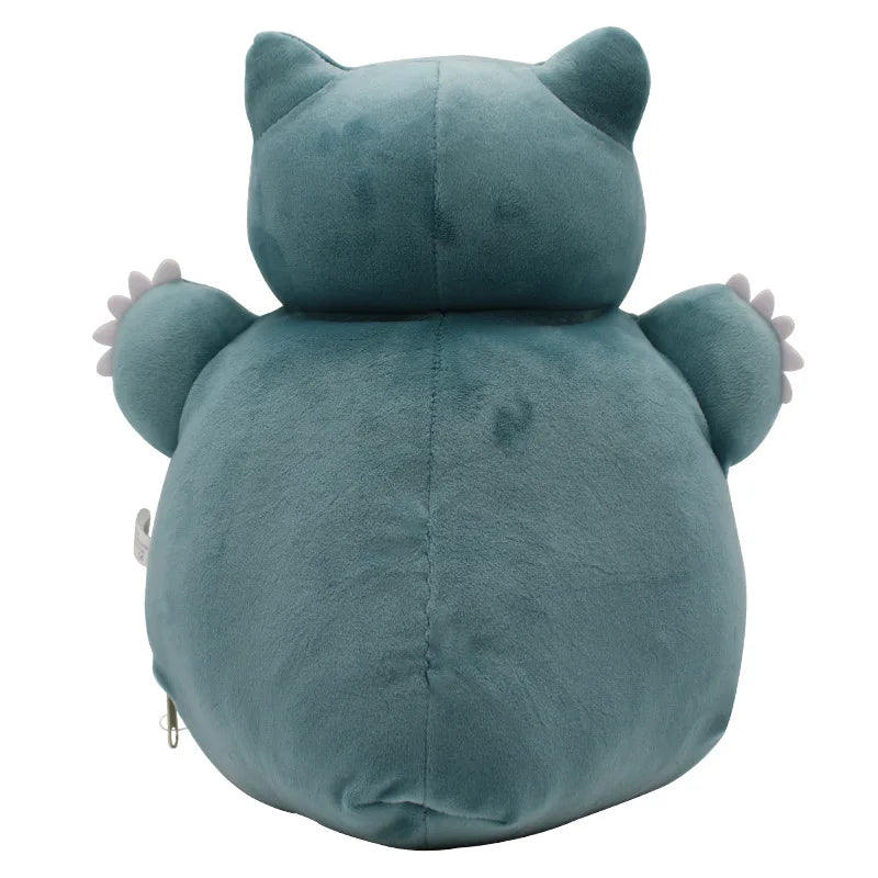 Pokemon Ditto Snorlax Plush Toy – Inside-Out Pillow A plush toy shaped like a round, cat-like character, shown from the back on a plain white background. The toy is a dusty teal-blue color with small light gray claws on its outstretched arms.