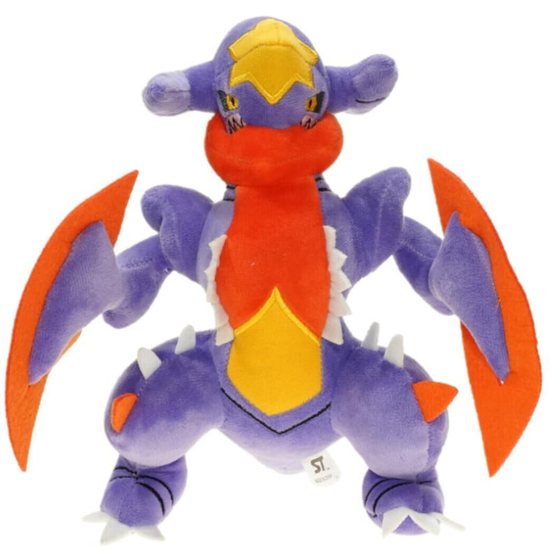 Pokemon Garchomp Plush Toy – Garchomp, Gabite & Gible Stuffed Animal Plush toy of a dragon-like creature with purple, orange, and yellow colors on a white background