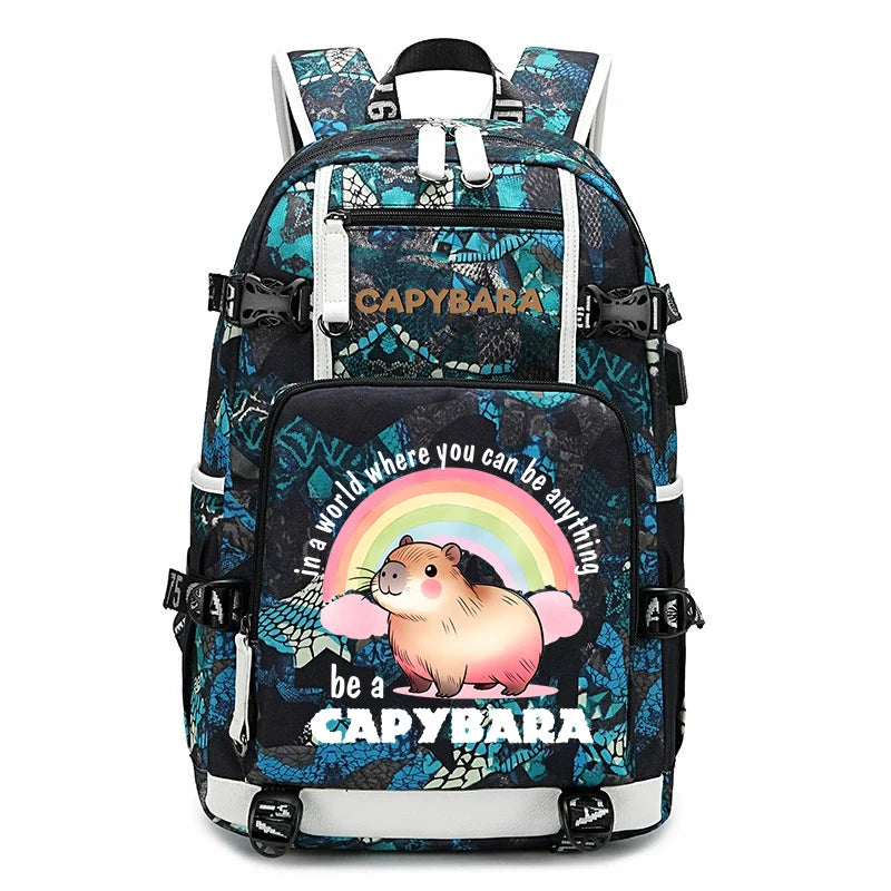 Capybara Backpack – Large Capacity Lightweight School Bag A backpack with a black and teal patterned design, featuring a cartoon capybara under a rainbow on the front pocket with the text 'In a world where you can be anything be a CAPYBARA'. The brand name 'CAPYBARA' is printed on the upper pocket.