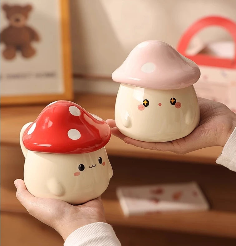 Cute Mushroom Coffee Mug with Lid – 400ML Ceramic Cup Two cute mushroom-shaped night lights held by a person in a room setting.