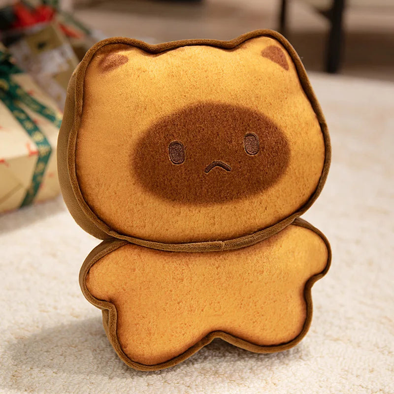 Capybara Bread Pillow – Cute Toast Plush Cushion Brown plush toy with a sad face on a textured surface