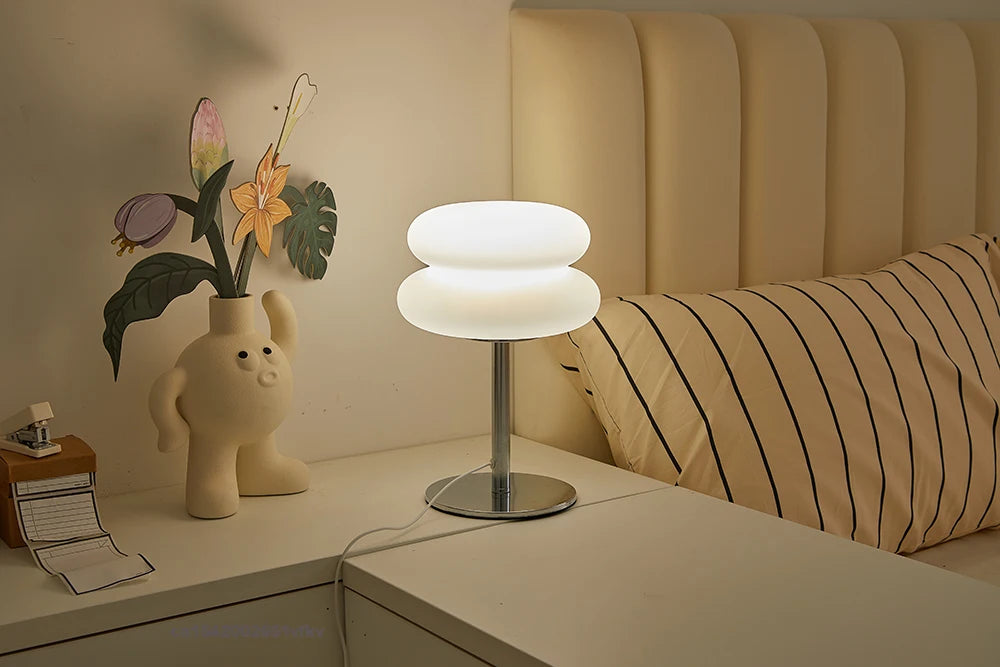 Orange Mushroom Bedside Table Lamp – USB Tri-Color Dimmable Light Modern table lamp on a nightstand next to a bed with pillows