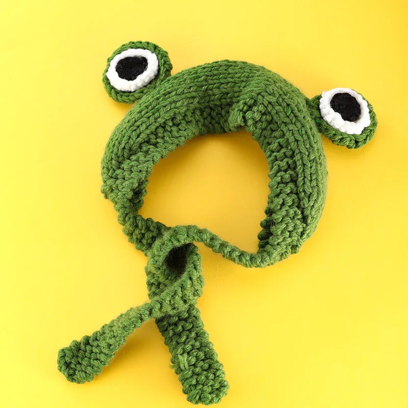 Cute Green Frog Crochet Beanie Hat – Knitted Winter Costume Cap Green knitted frog toy on a yellow background