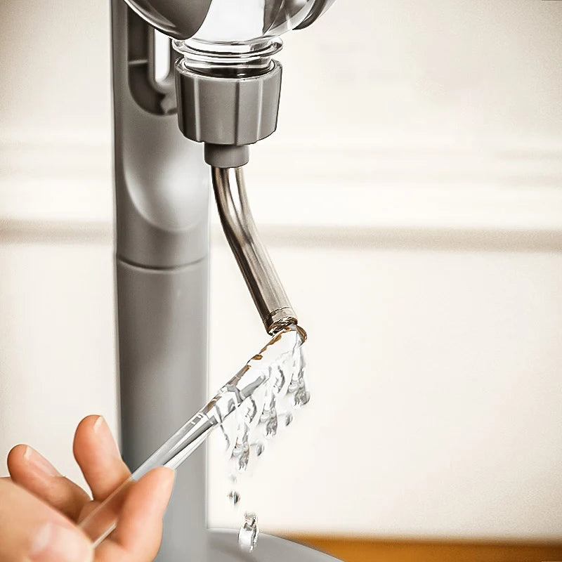 Automatic Pet Water Dispenser & Food Feeder Anti-Tip Close-up of a water dispenser with water flowing into a glass.