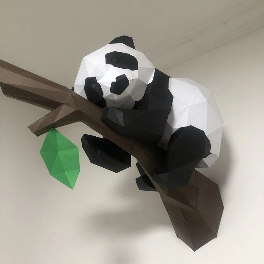 Doberman 3D Paper Model – DIY Animal Papercraft Room Decor Low poly panda model on a branch with a green leaf against a plain background