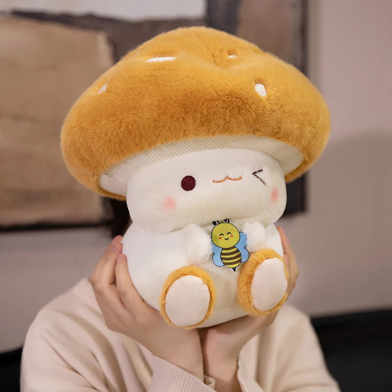 Creative Mushroom Plush Pillow – Cute Stuffed Plant Cushion for Home Décor Plush toy shaped like a cartoon character with a mushroom hat held by a person.