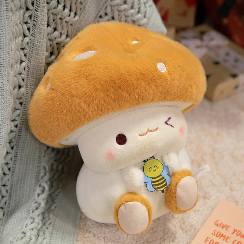 Creative Mushroom Plush Pillow – Cute Stuffed Plant Cushion for Home Décor Cute plush toy resembling a mushroom with a bee tag on a textured surface