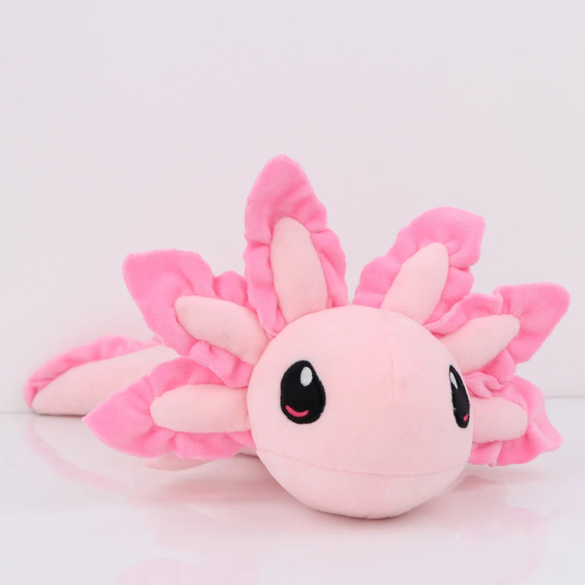 Axolotl Squishmallow Plush Toy – Soft Stuffed Animal Pink axolotl plush toy on a light pink background