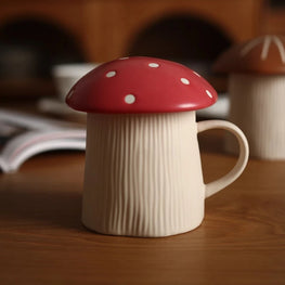 Mushroom-shaped mug with a red cap on a wooden surface
