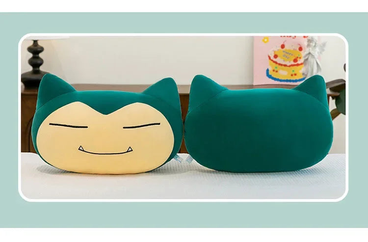 Pokemon Snorlax Plush Pillow – Cute Oversized Stuffed Animal Two Snorlax-shaped plush pillows in teal green and cream yellow, displayed side-by-side on a white surface with a light blue-green border frame.