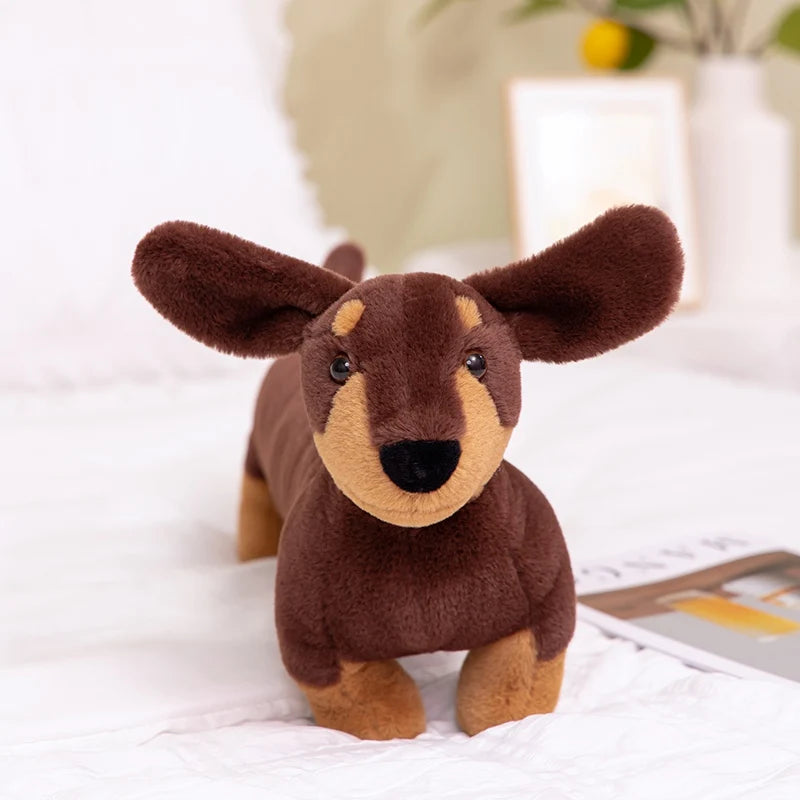 Realistic Dachshund Plush Dog Stuffed Animal Brown plush dog toy on a white surface with a blurred background