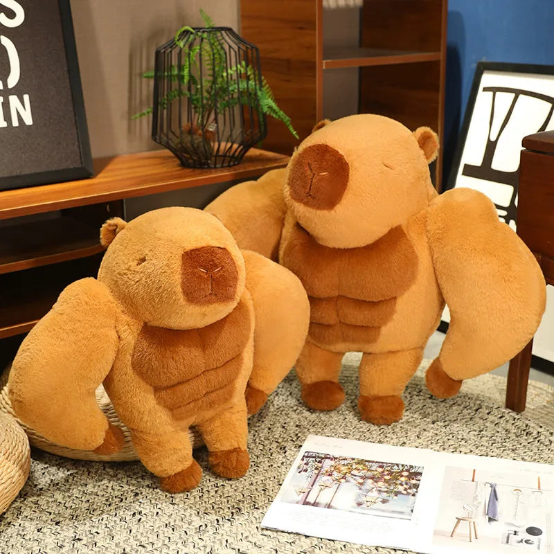 Muscle Capybara Plush Pillow – Funny Brown Stuffed Animal Cushion Two brown teddy bears on a carpeted floor with a magazine underneath.