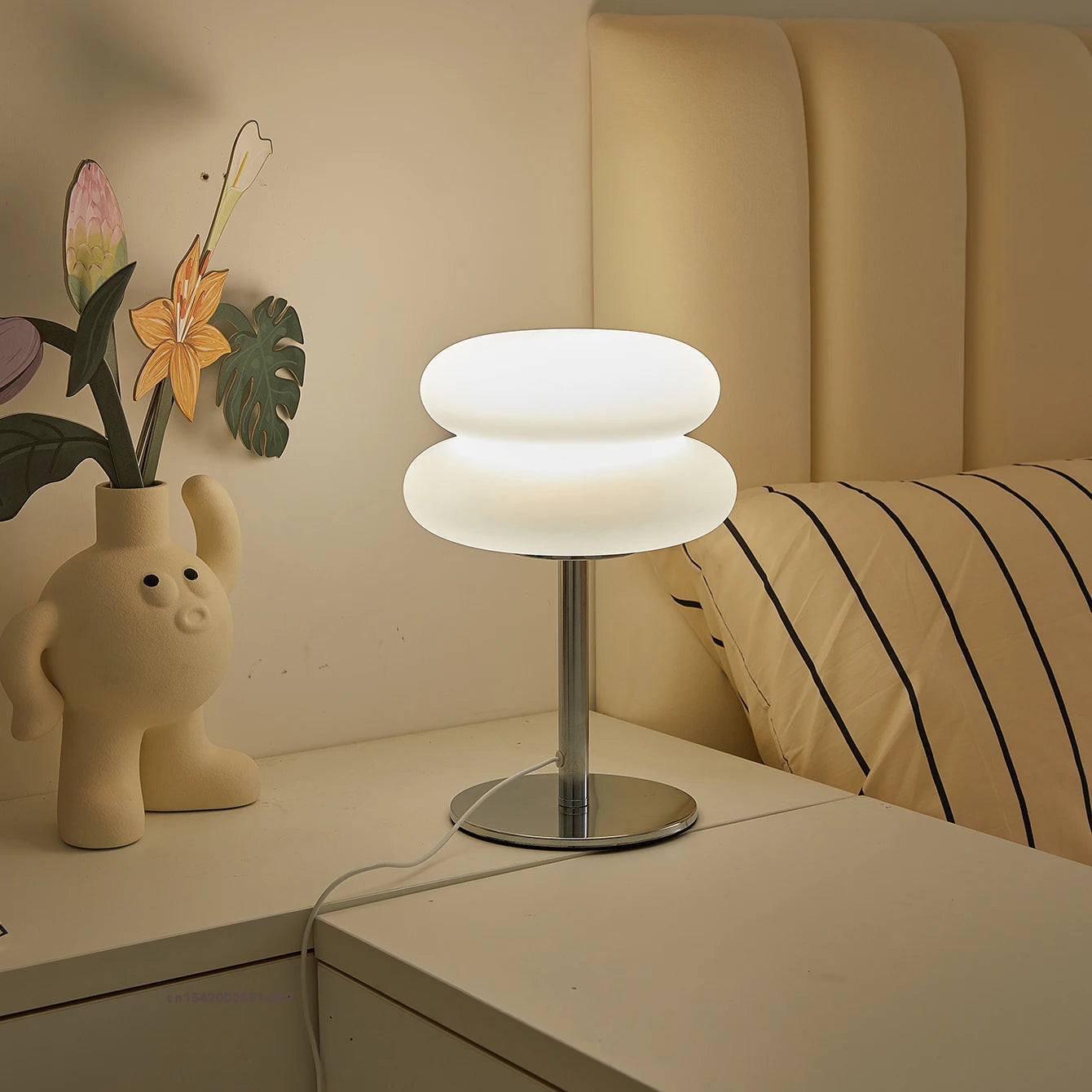 Orange Mushroom Bedside Table Lamp – USB Tri-Color Dimmable Light Modern table lamp on a bedside table with decorative elements.