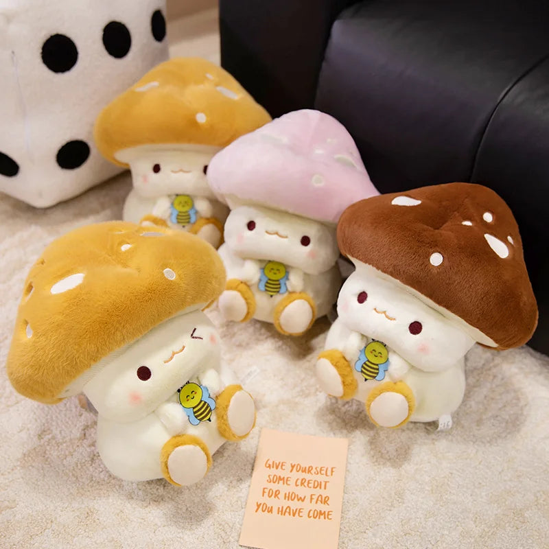 Creative Mushroom Plush Pillow – Cute Stuffed Plant Cushion for Home Décor Set of cute mushroom-shaped plush toys with a motivational card on a soft surface.