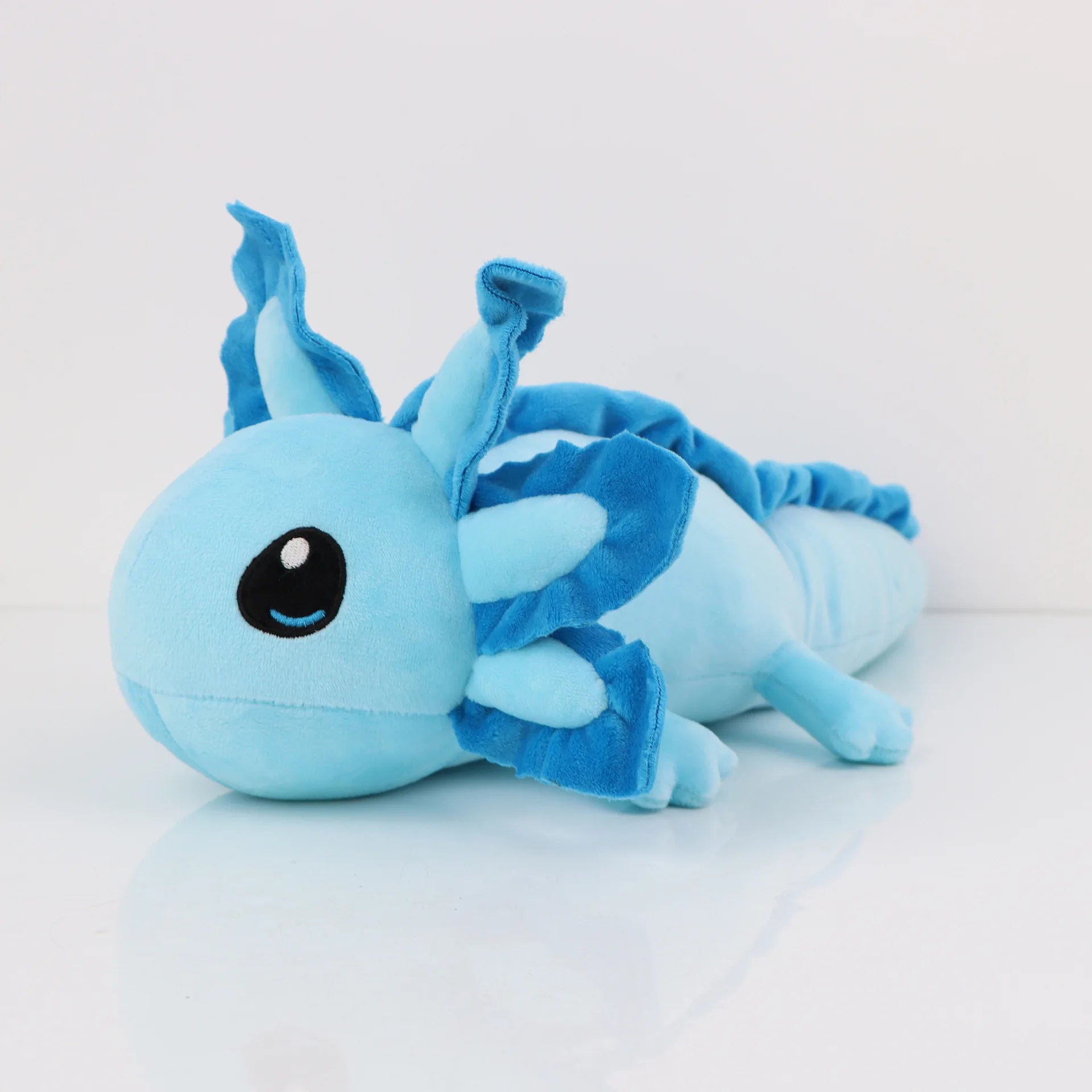 Axolotl Squishmallow Plush Toy – Soft Stuffed Animal Blue plush toy with a black eye on a white background
