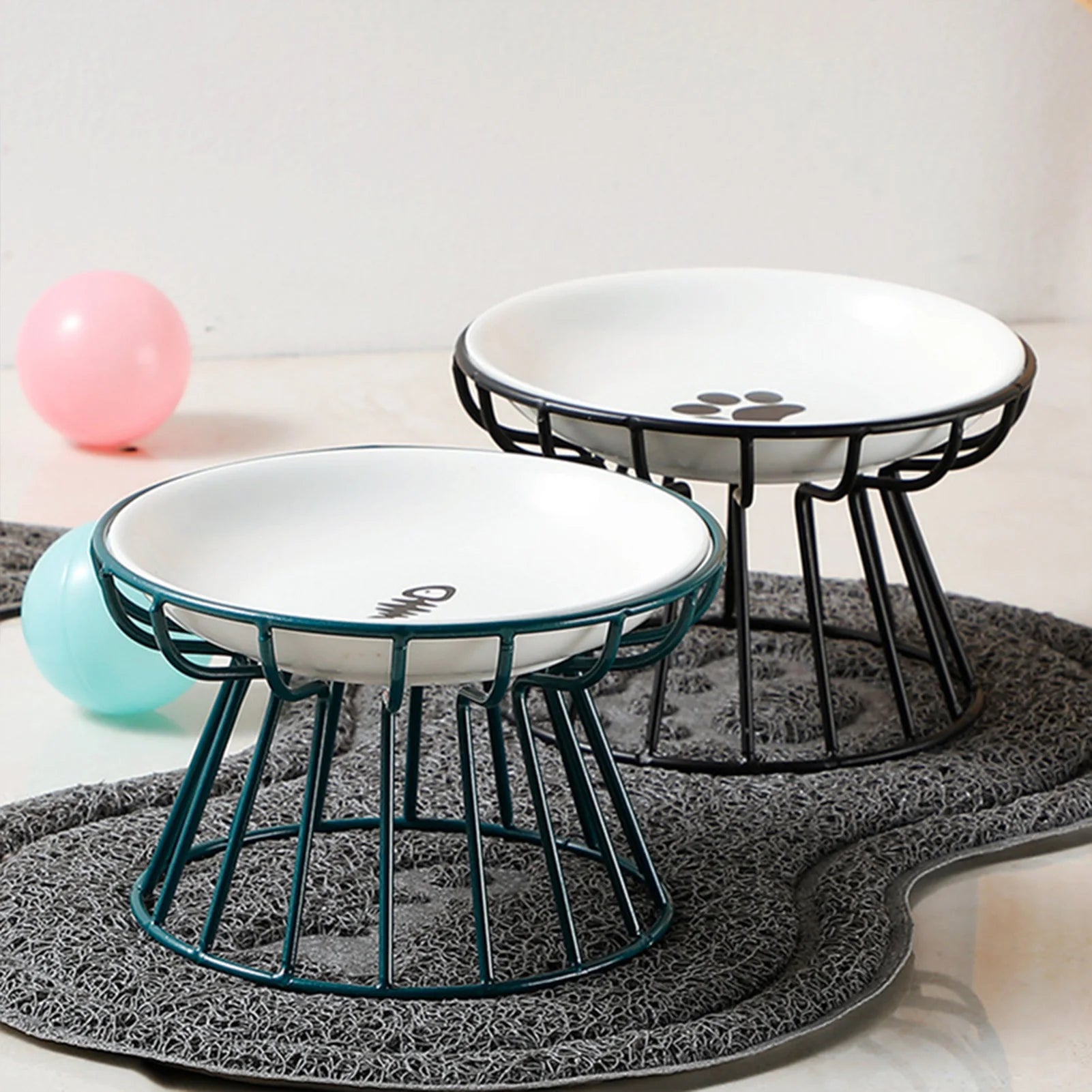Ceramic Elevated Pet Bowl with Stand Food & Water Two elevated pet feeding stations with paw prints on a gray mat.