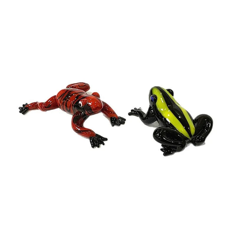 Murano Glass Frog Figurine – Cute Animal Tabletop Home Décor Gift Two glass frog figurines, one red and black, the other green and black, on a white background.