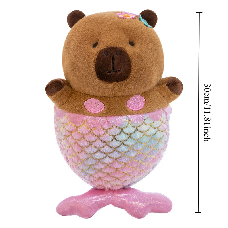 Mermaid Capybara Plush Toy – Cute Kawaii Stuffed Doll A capybara plush toy with a pink mermaid tail and shell accents, shown on a white background with a vertical height measurement marker reading 30cm/11.8 inches.