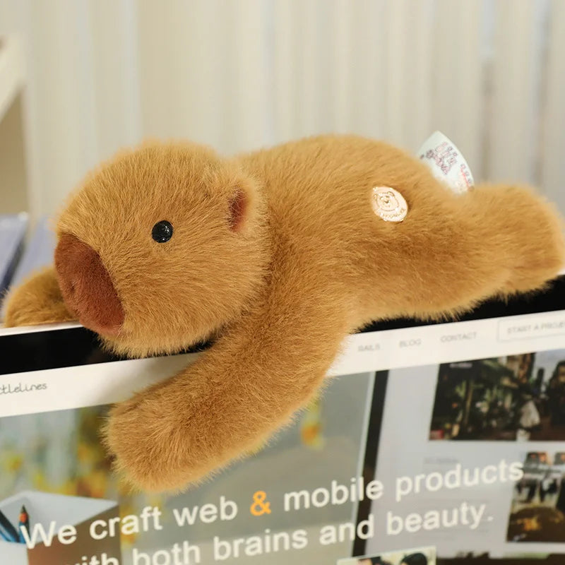 Weighted Capybara Plush Pillow – Soft Stuffed Animal Brown teddy bear plush toy on a shelf with blurred background