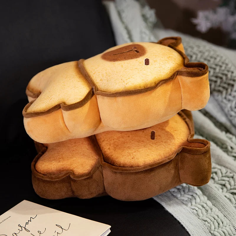 Capybara Bread Pillow – Cute Toast Plush Cushion Plush turtle shell toy on a dark surface with a blurred background