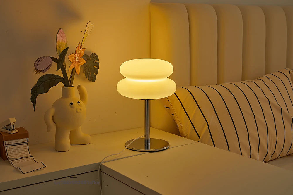 Orange Mushroom Bedside Table Lamp – USB Tri-Color Dimmable Light Lamp on a nightstand next to a bed with pillows and decorative items.