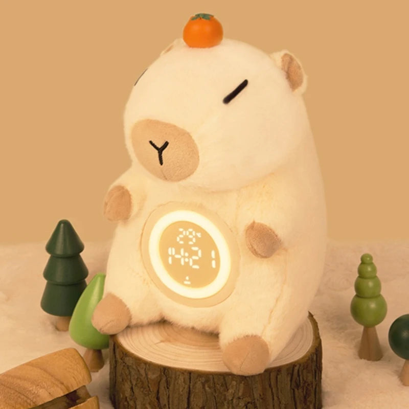 Capybara Plush Alarm Clock & Night Light – Adjustable Brightness Plush toy resembling a bear with a digital clock display on a wooden stump, surrounded by small trees.
