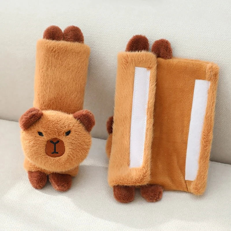 Capybara Car Headrest Neck Pillow & Tissue Holder – Plush Car Decor Brown bear-shaped slippers on a white surface with a neutral background