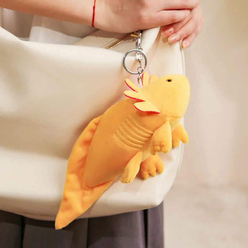 Cute Axolotl Plush Toy – Squishmallow Salamander Stuffed Animal Yellow lizard-shaped keychain attached to a white handbag.