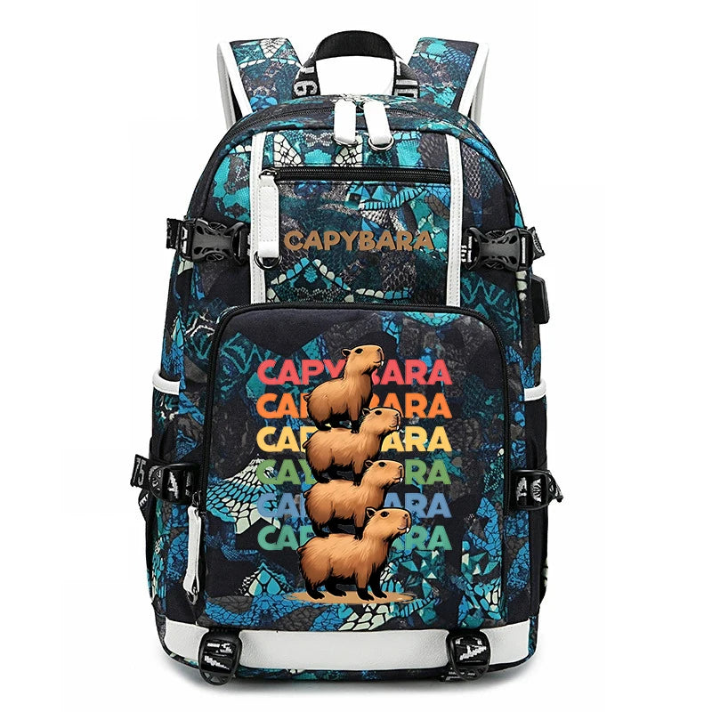 Capybara Backpack – Large Capacity Lightweight School Bag A backpack featuring a dark blue and black reptile pattern with a large front pocket printed with the word 'CAPYBARA' in colorful letters and three cartoon capybaras. The brand name 'Capybara' is also printed on the upper front pocket.