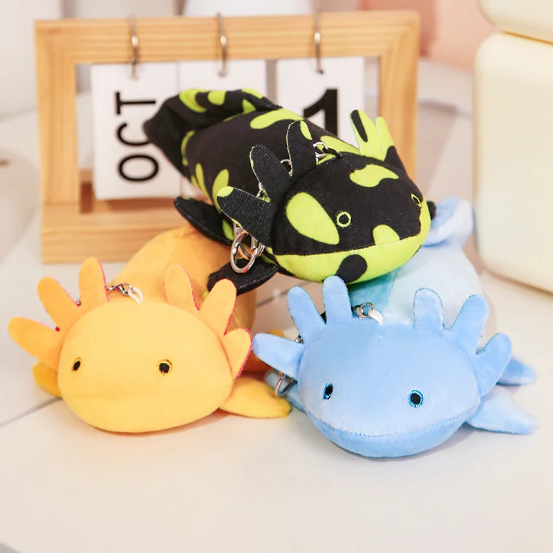 Cute Axolotl Plush Toy – Squishmallow Salamander Stuffed Animal Three colorful plush keychains shaped like animals on a light surface.