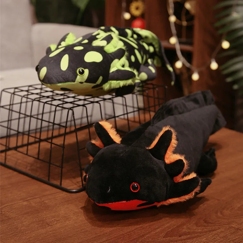 Cute Axolotl Plush Toy – Squishmallow Salamander Stuffed Animal Two plush toys shaped like salamanders on a wooden surface with a blurred background.