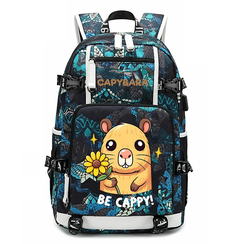 Capybara Backpack – Large Capacity Lightweight School Bag A black and blue patterned backpack with a cartoon hamster graphic holding a yellow flower on the front pocket, with the text 'BE CAPPY!' and 'CAPPYBARA' visible.