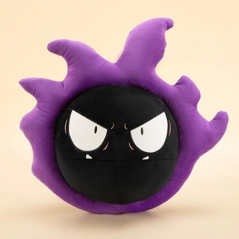 Pokemon Gastly Plush Pillow Stuffed Toy A plush toy pillow shaped like a round black character with an angry face and purple spiky outer edges, photographed on a plain warm beige background.