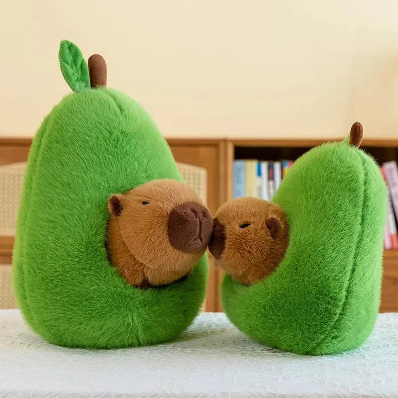Avocado Capybara Plush Toy – Cute Soft Pillow Two plush avocado toys with bear faces on a white surface.