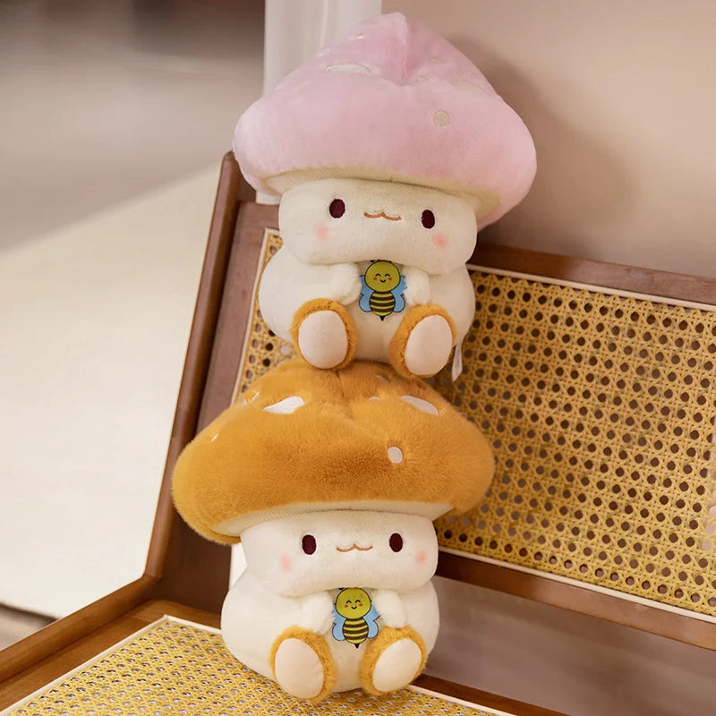 Creative Mushroom Plush Pillow – Cute Stuffed Plant Cushion for Home Décor Two plush toys resembling cartoon characters with mushroom hats on a wooden surface.