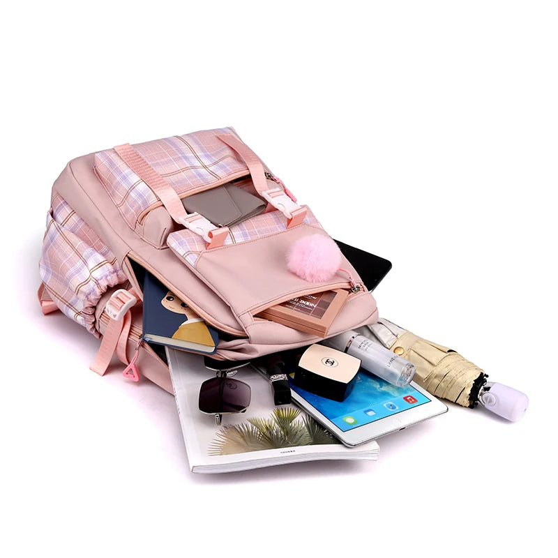 Capybara Bubble Tea Backpack – School Bag for Teens Pink plaid backpack with various items spilling out on a white background