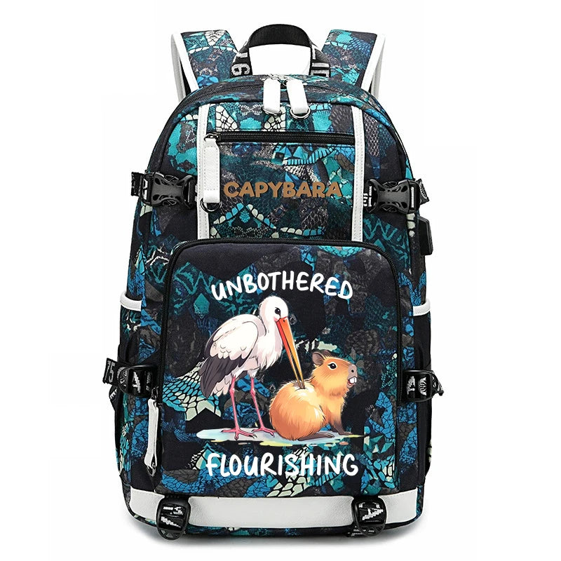 Capybara Backpack – Large Capacity Lightweight School Bag A multi-compartment backpack with a black and teal patterned design, featuring a front pocket with a cartoon stork and a hamster illustration and the words 'UNBOTHERED FLOURISHING'.