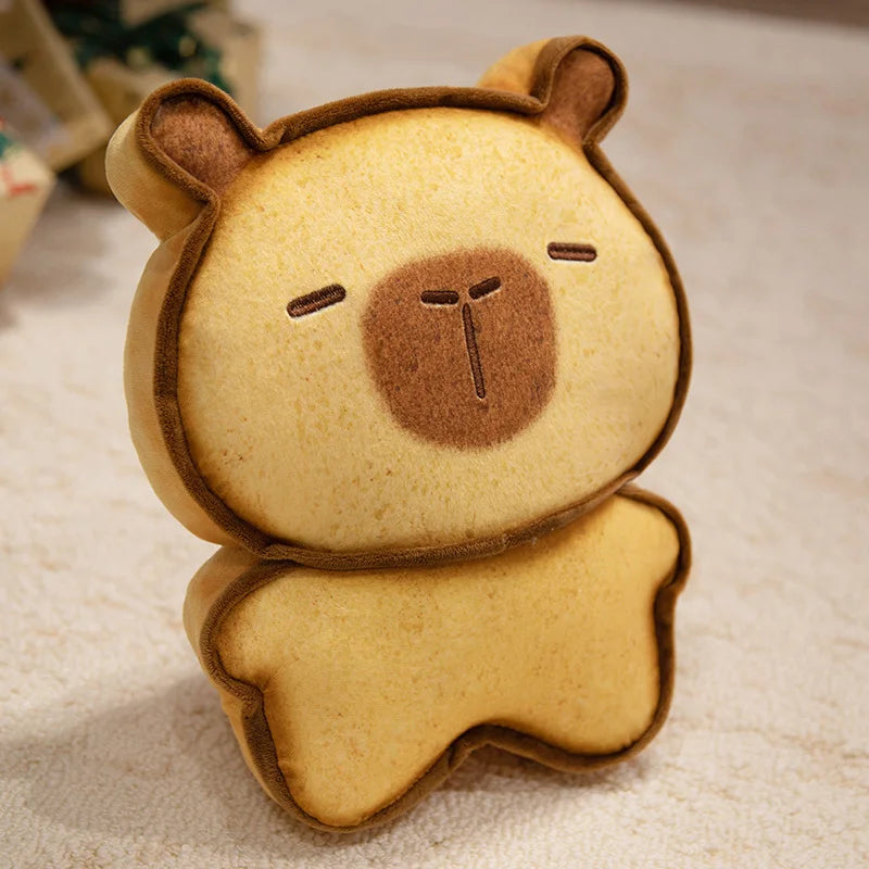 Capybara Bread Pillow – Cute Toast Plush Cushion Plush toy shaped like a bear with a simple face on a textured surface