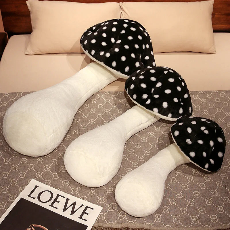 Large Mushroom Plush Pillow – Soft Huggable Stuffed Plant Cushion Three plush mushroom toys on a patterned surface with a LOEWE magazine.