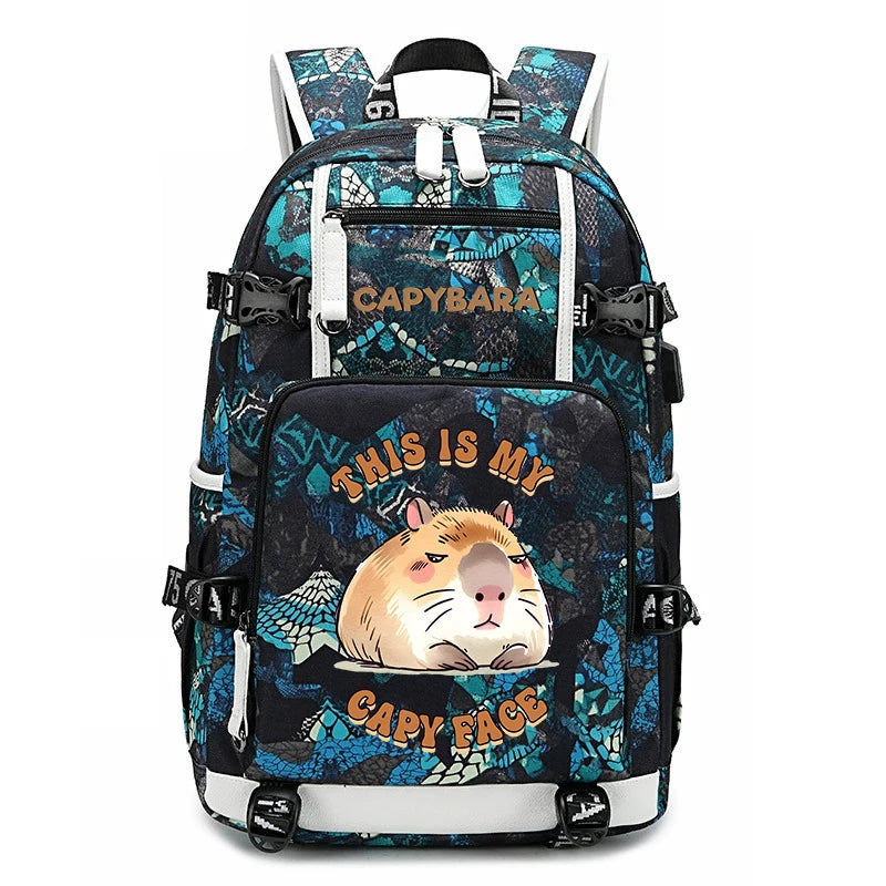 Capybara Backpack – Large Capacity Lightweight School Bag A backpack with a black and teal capybara-themed pattern, featuring a large front pocket with a cartoon capybara graphic and the text 'THIS IS MY CAPYBARA FACE'.