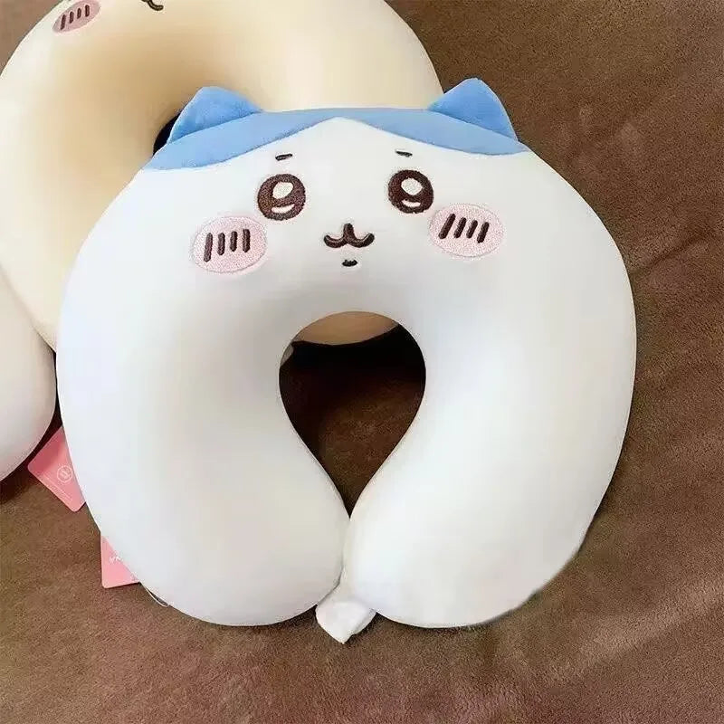 Cute Capybara U-Shaped Neck Pillow – Plush Travel Pillow Cute cartoon-style neck pillow with a cat face design on a brown surface