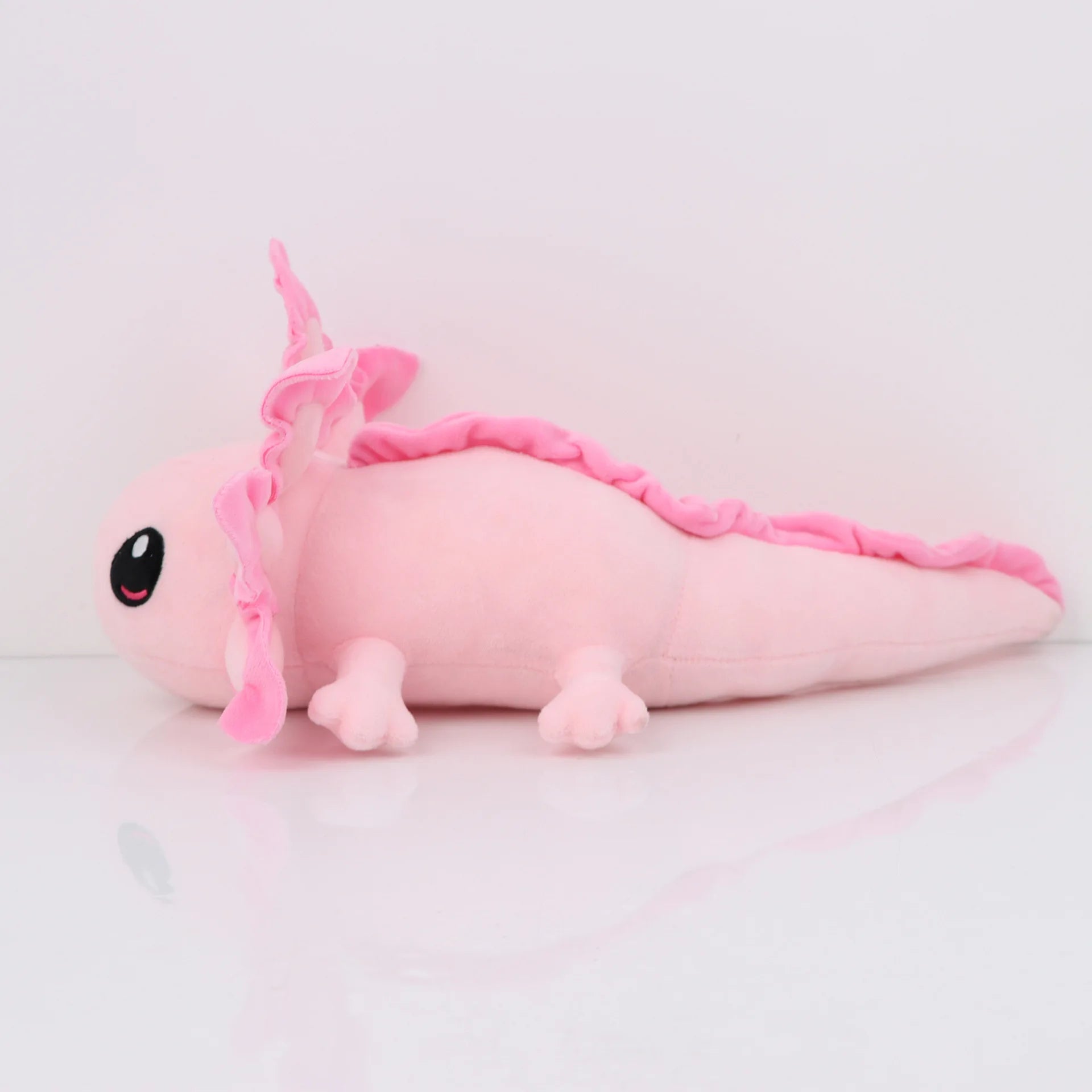 Axolotl Squishmallow Plush Toy – Soft Stuffed Animal Pink plush toy with a unicorn horn on a light gray background