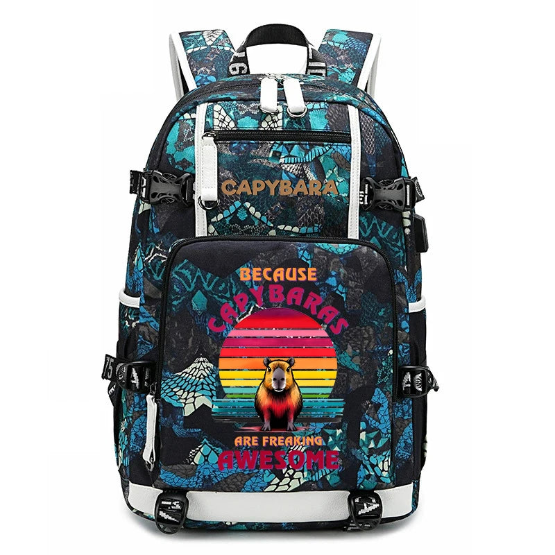 Capybara Backpack – Large Capacity Lightweight School Bag A backpack with a black and teal snake-print pattern, featuring a central graphic of a cat in front of a colorful sunset with the text 'BECAUSE CAYBARAS ARE FREAKING AWESOME'.