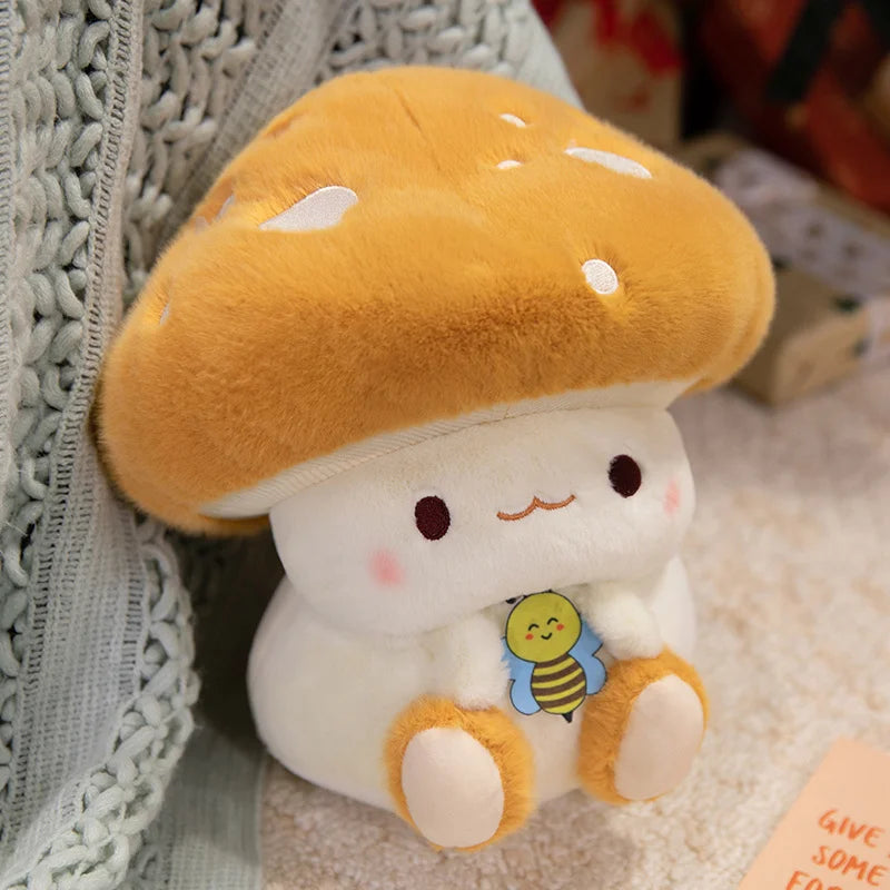 Creative Mushroom Plush Pillow – Cute Stuffed Plant Cushion for Home Décor Cute plush toy resembling a mushroom with a bee tag on a textured surface