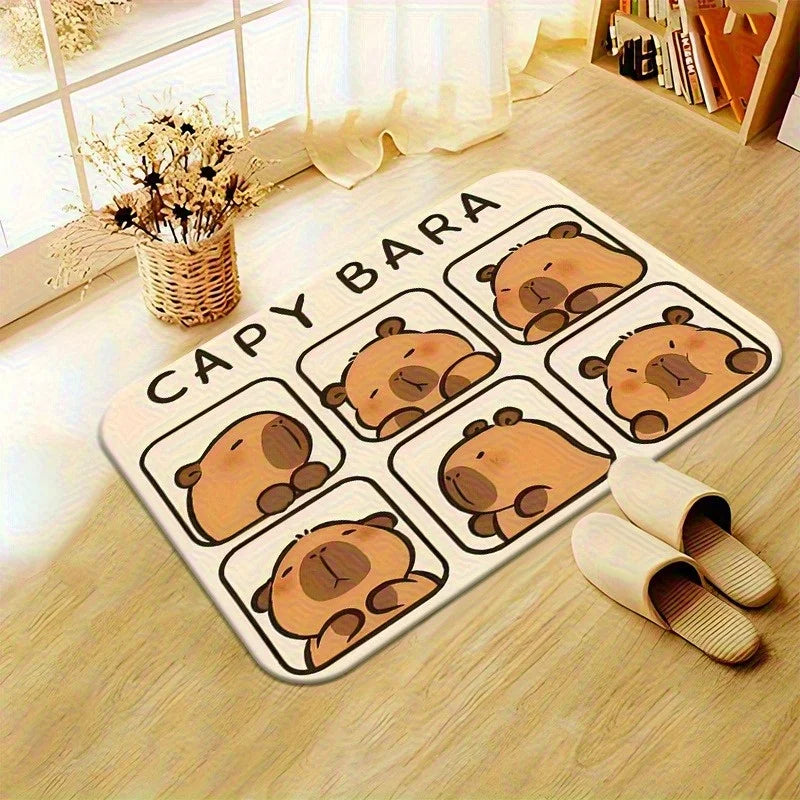 Capybara Doormat – Soft Flannel Non-Slip Indoor & Outdoor Rug A rectangular floor mat with a cute cartoon capybara design and the text 'CAPY BARA' printed on it, shown on a light wood floor in a bright room with slippers and a vase nearby.