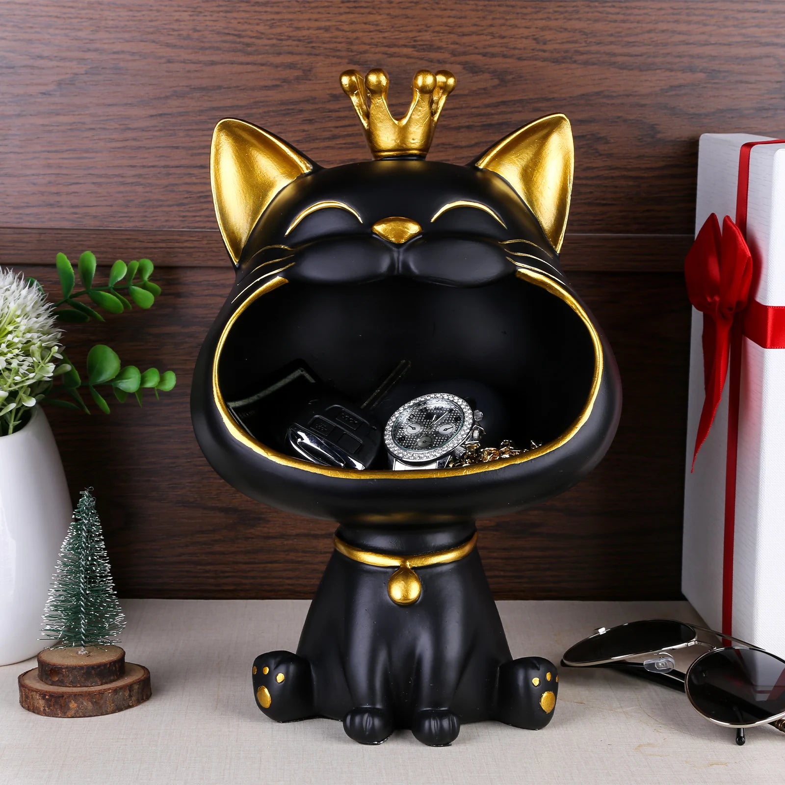 Lucky Cat Figurine with Storage Box – Resin Laughing Cat Home Decor Black cat-shaped jewelry box with gold accents on a wooden surface.
