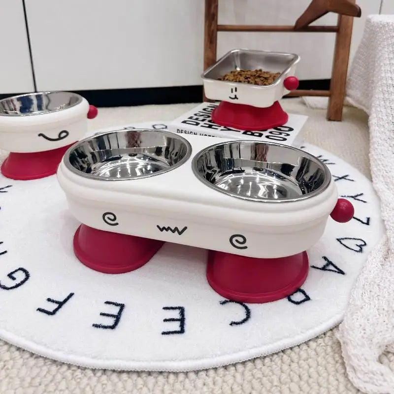 Elevated Pet Bowl Stainless Steel Anti-Slip Feeding Dish Pet feeding station with two bowls on a circular mat with lettering