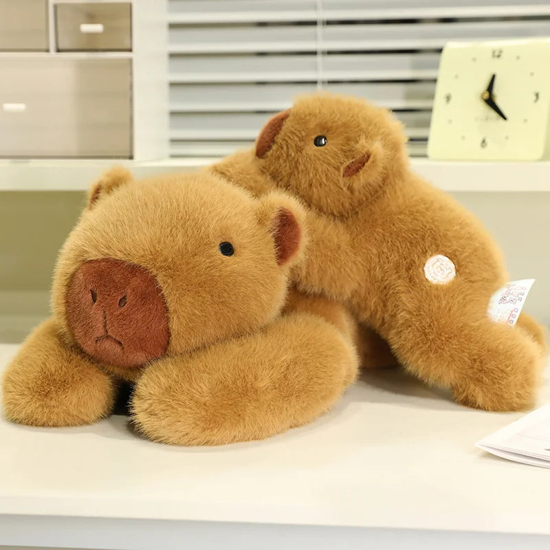 Weighted Capybara Plush Pillow – Soft Stuffed Animal Brown teddy bear sitting on a surface with a blurred background