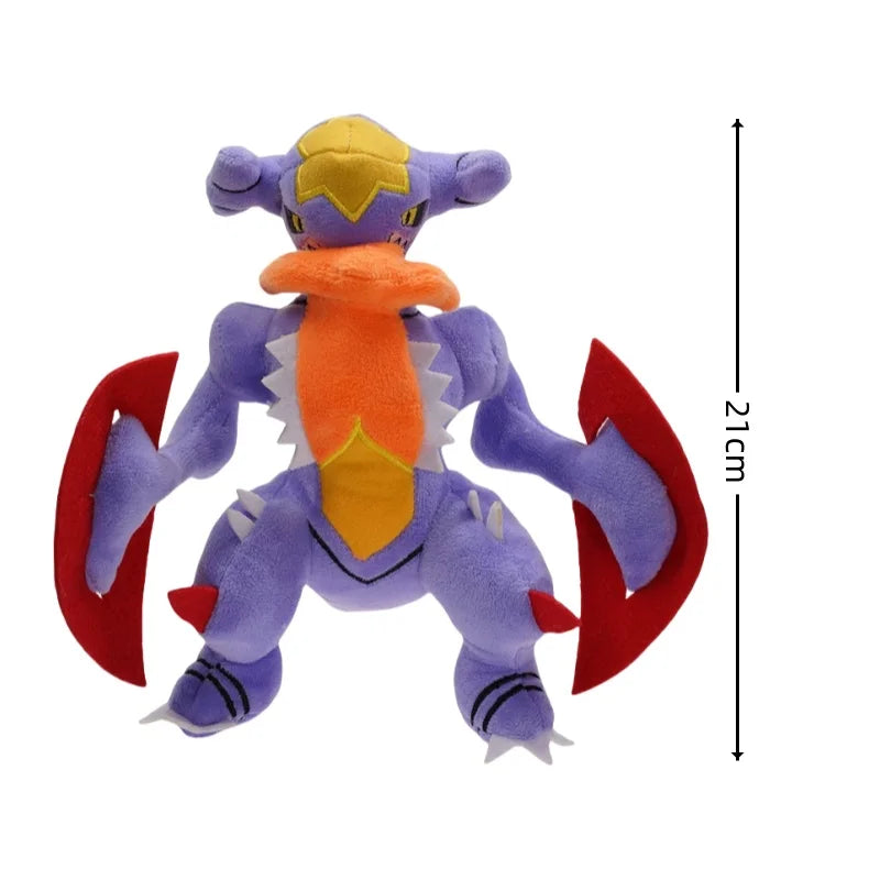 Pokemon Garchomp Plush Toy – Garchomp, Gabite & Gible Stuffed Animal Plush toy of a purple creature with red wings and yellow accents, shown with a measurement label indicating 21cm.